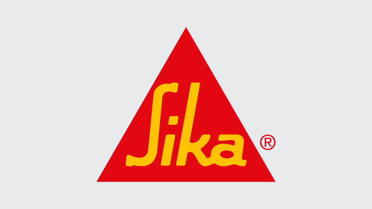 Network Transformation customer: A red triangle with the word "Sika" written inside in yellow, italicized letters. The logo is positioned against a light gray background.