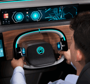 A person holds a futuristic, rectangular Kelvion steering wheel with glowing blue accents in a modern car. The dashboard displays digital screens with navigation, music, and vehicle information.